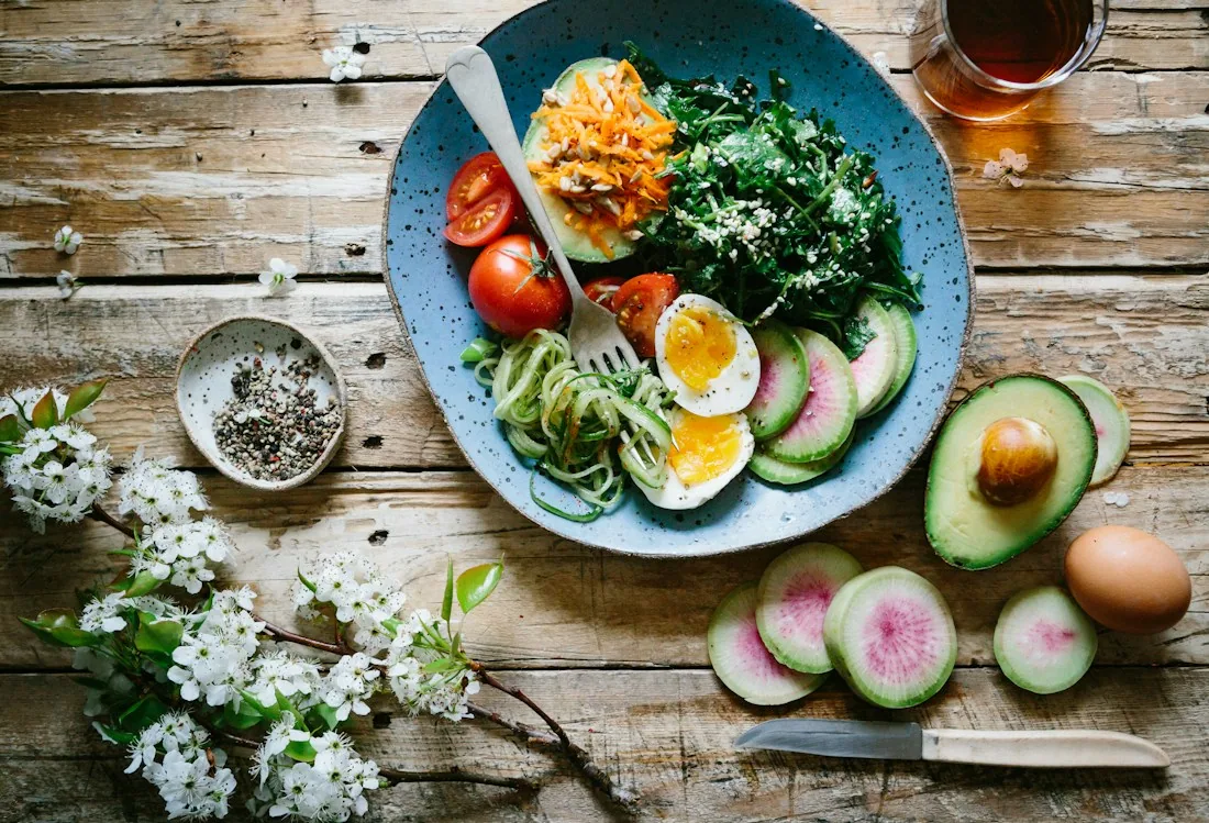 A colorful selection of fresh vegetables, fruit, and everyday foods
